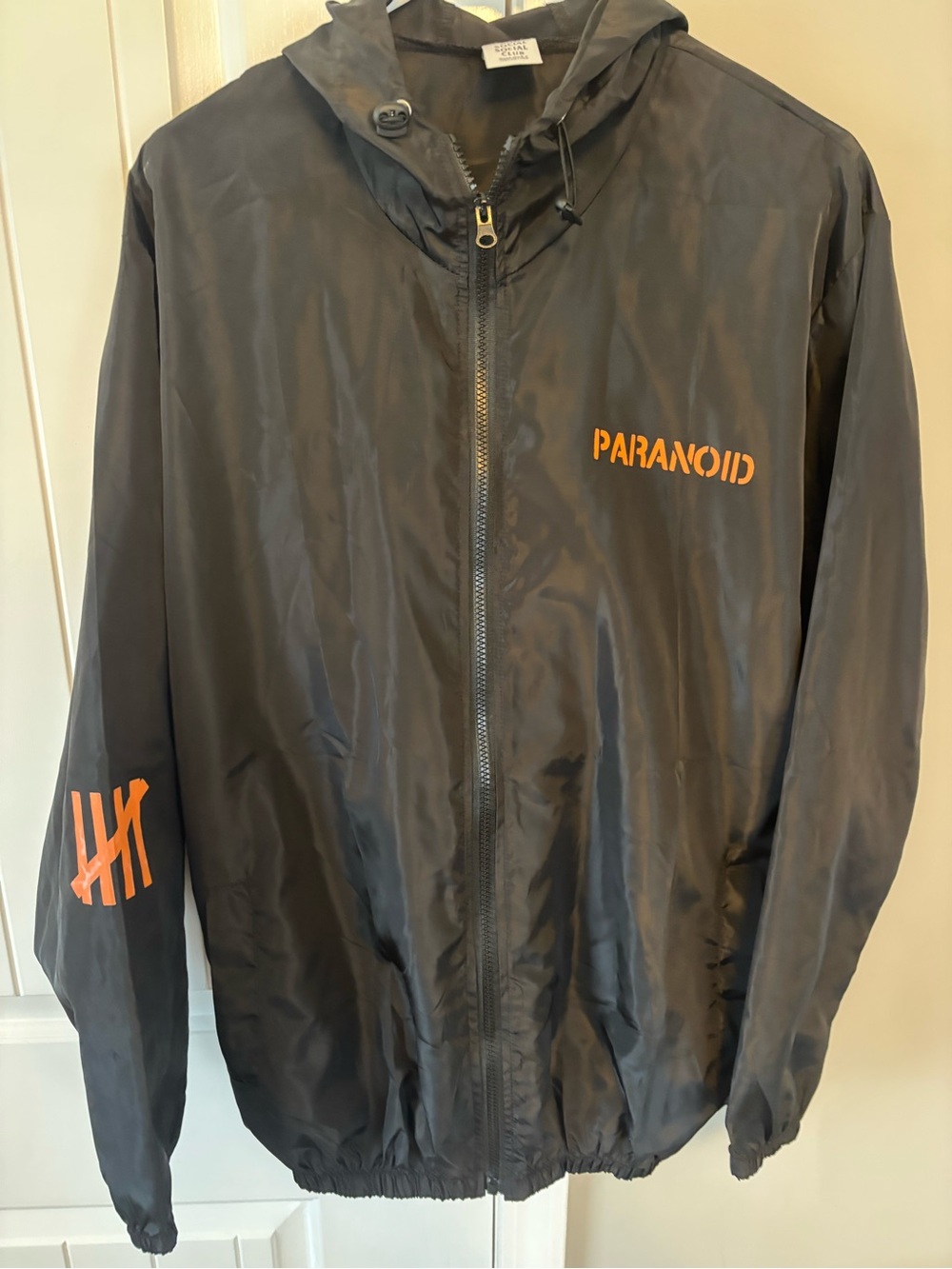 Anti Social Social Club Black Hooded Windbreaker with Orange Print
